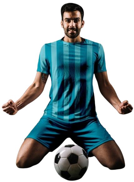 Soccer player in a blue striped kit kneeling and celebrating with a ball