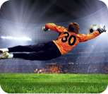 Goalkeeper in orange jersey number 30 diving to make a save in a floodlit stadium