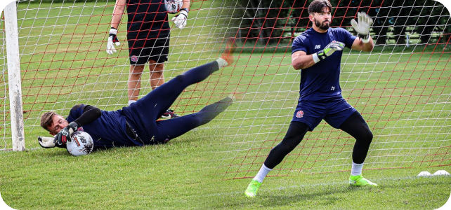 2:21 AMTwo goalkeepers in navy kit training together